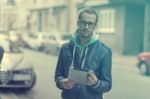 Man On Street Use Ipad Tablet Computer Stock Photo