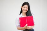 Asia Thai High School Student Uniform Beautiful Girl Read A Book Stock Photo