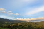 Scenic Of Clouds Over Mountain Stock Photo