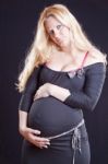 Pregnant Woman Holding Tummy Stock Photo