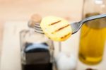 Grilled Potato On A Fork Stock Photo