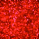 Defocused Red Abstract Christmas Background With Bokeh Effect Stock Photo