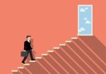 Businessman Stepping Up A Staircase To Success Stock Photo