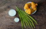 Croissant On Dish With Rice Milk And Ear Of Rice  On Old Wooden Stock Photo