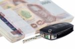 Close Up Car Key And Stacks Of Money Thai Baht Stock Photo