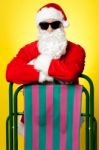 Stylish Male Santa Posing With A Deckchair Stock Photo