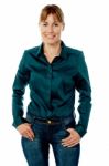 Trendy Lady Standing With Hands In Pocket Stock Photo