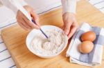 Woman Mixing Ground Flaxseed And Flour Stock Photo