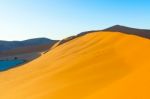 Early Morning Climbers On Sand Dune Near Sossusvlei, Namibia Stock Photo