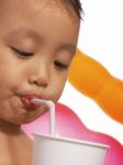 Child Is Drinking Stock Photo