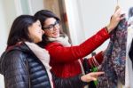 Two Beautiful Girls Shopping In A Clothes Shop Stock Photo