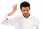 Chef Holding Knife Threateningly Stock Photo