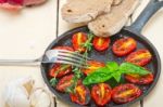 Baked Cherry Tomatoes With Basil And Thyme Stock Photo