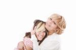 Mother Hugging Her Daughter Stock Photo