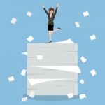 Business Woman Celebrating On A Lot Of Documents Stock Photo