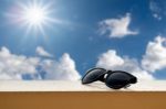 Black Sunglasses Resting On The Balcony Stock Photo