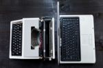 Typewriter And Computer Laptop On Wooden Background Retro Stock Photo