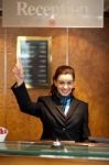 Receptionist showing Pointing Up Stock Photo