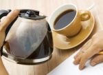 Man Pouring Coffee Into Cup Stock Photo