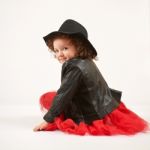 Little Girl Fashion Model With Black Hat Stock Photo