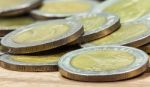 Coins Of Thailand. Wat Arun Temple In Bangkok, Thailand, Depicted In The Thai Ten Baht Coin Stock Photo