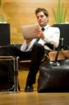 Business Man Waiting With Ipad Stock Photo