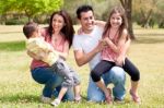 Happy Family Enjoying In The Park Stock Photo