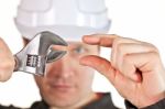 Handyman Wearing Uniform And Hardhat Stock Photo