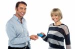 Middle Aged Couple Showing Cash Card To You Stock Photo