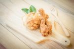 Fried Chicken In Batter  On A Wooden Background Stock Photo