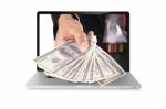 Dollars On Laptop Stock Photo