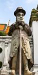 Statue Of Man At Wat Pho In Bangkok, Thailand Stock Photo