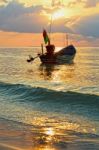 Beautiful  Fishing Boat Floating With Golden Sunrise Light Backg Stock Photo