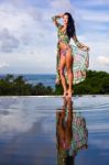 Pretty Brunette Model In Bikini Posing At The Pool Stock Photo