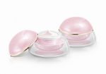 Two Pink Dome Cosmetic Jar On White Background Stock Photo