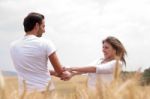 Loving Couple In Field Stock Photo