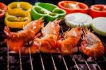 Shrimp,prawns Grilled On Barbecue Fire Stove With Chilly Onion For Seafood Meal Stock Photo