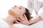 Woman Enjoying Massage At Beauty Spa Stock Photo