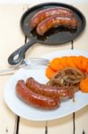 Beef Sausages Cooked On Iron Skillet Stock Photo