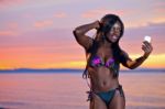 Beautiful Black African American Woman Posing On The Beach At Su Stock Photo