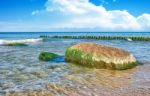 Sea Waves Break Down On A Large Stone Stock Photo