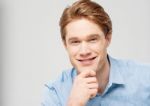 Smart Young Man Posing To Camera Stock Photo