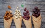 Concept For Homemade Various Nuts Ice Cream. Mixed Nuts In Waffl Stock Photo