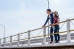 Male Tourists Enjoy The Bridge Stock Photo