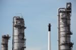 Distillation Towers On Blue Sky Background Stock Photo