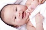 Asian Laughing Baby Stock Photo