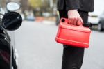 Man Holding Fuel Can, Cropped Image Stock Photo