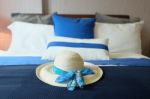 Bedroom With Pillows And Hat Stock Photo