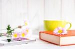 Coffee Cup And Books Or Journal With Flowers Stock Photo