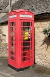 Defibrillator In And Old Phone Box In Upper Slaughter Village Stock Photo